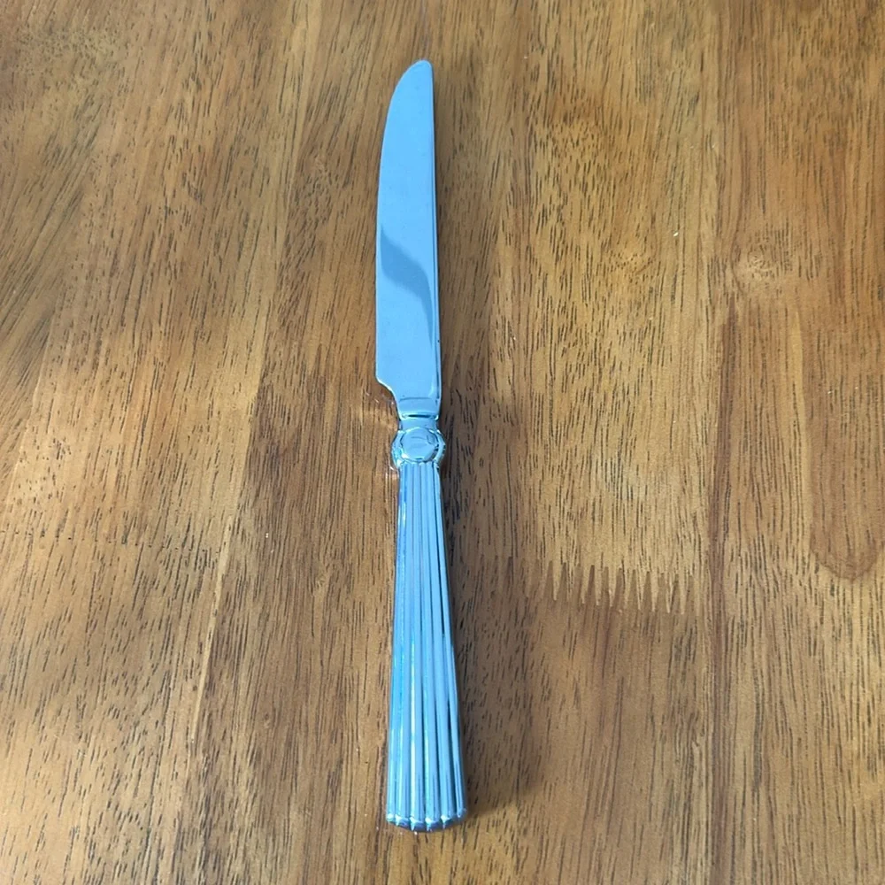 Waterford stainless butter knife. 18/10 handle. Carleton pattern. 9 3/4”.